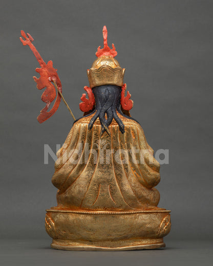 Back view of Tsokye Dorje statue with fine engraved robe and detailed hair
