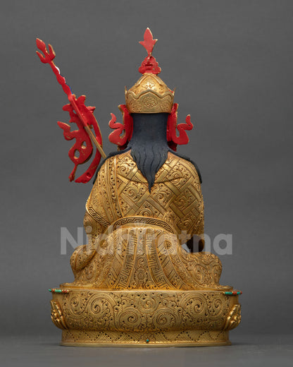 back view of tsokye dorje statue with khatvanga and detailed robes