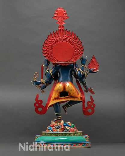 Back view of Ucchusma statue highlighting intricate copper alloy detailing, dynamic posture