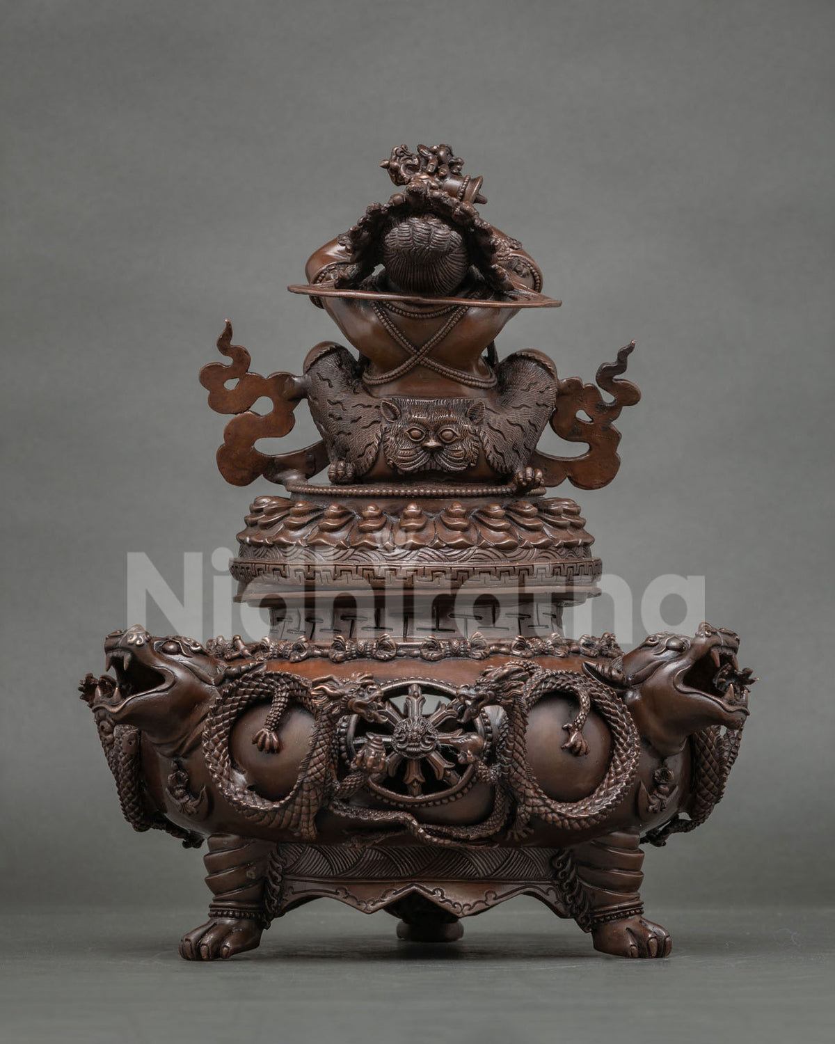 Back view of Vajradaka statue with lion-head and dragon incense burner base