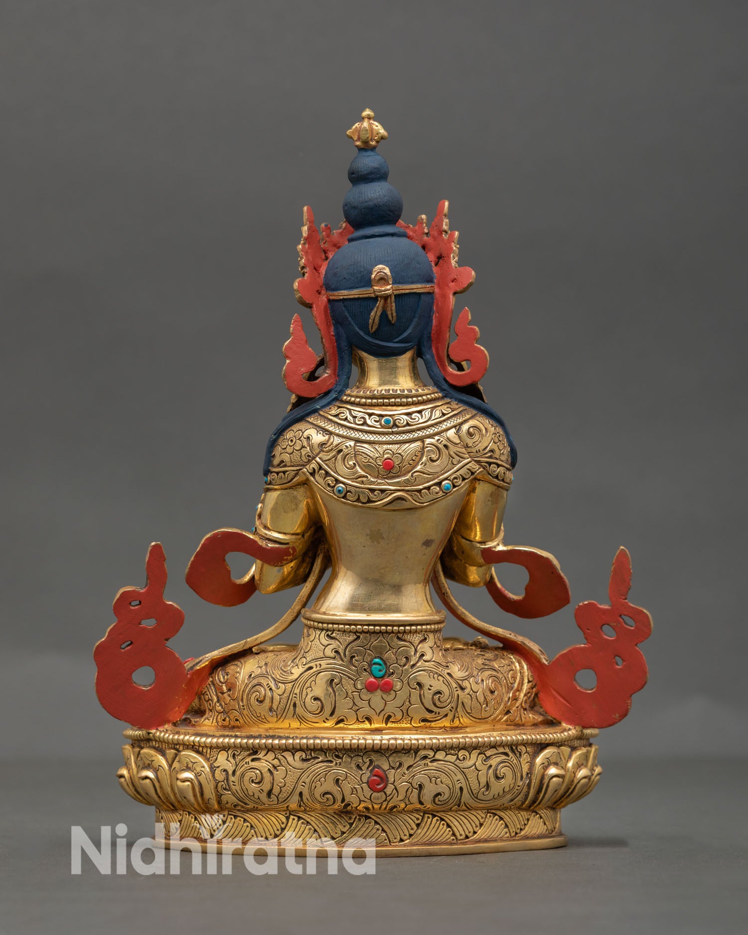 Back view of Vajradhara Buddhist sculpture in gold gilded copper with detailed ornamentation designed for meditation space altar