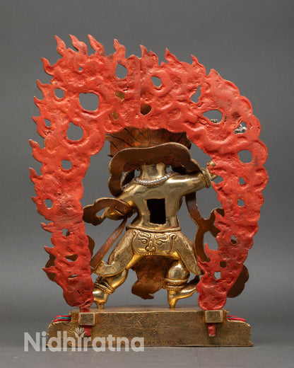 Back view of Vajrapani statue flaming aureole crown five skulls bone ornaments Himalayan sacred sculpture
