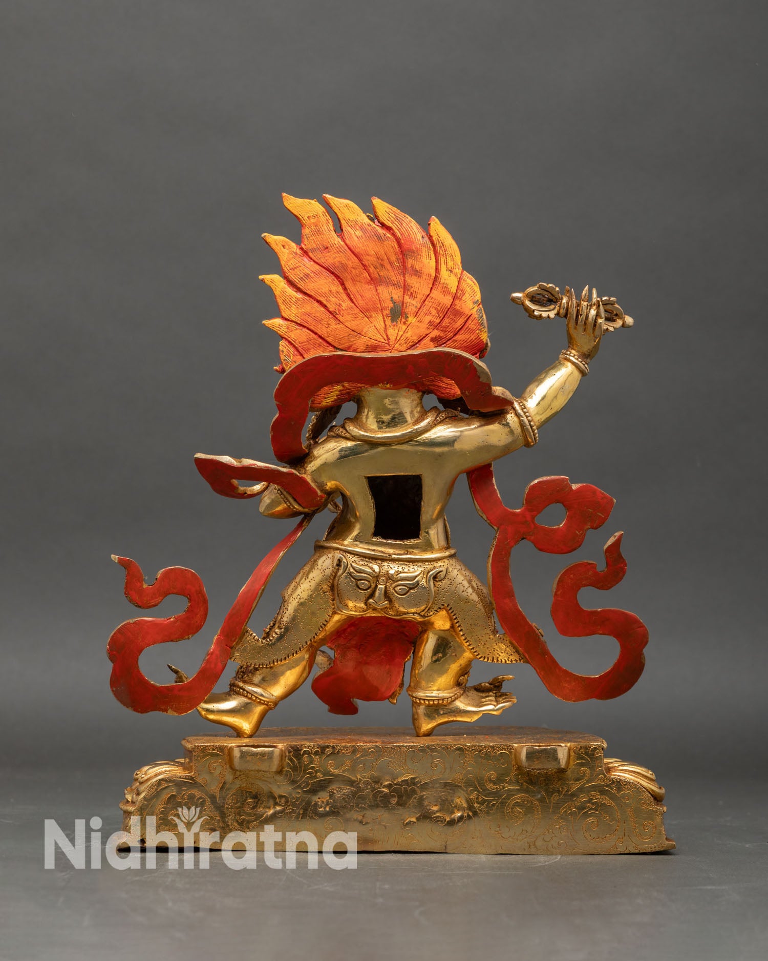 Back view of Vajrapani statue with detailed flame halo and sculpted robes