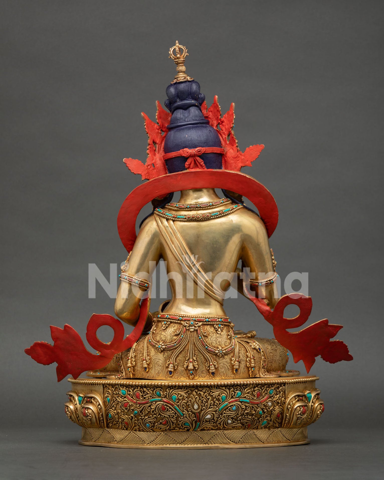 Back view of Vajrasattva statue revealing detailed metalwork and handcrafted Himalayan Buddhist sculpture design