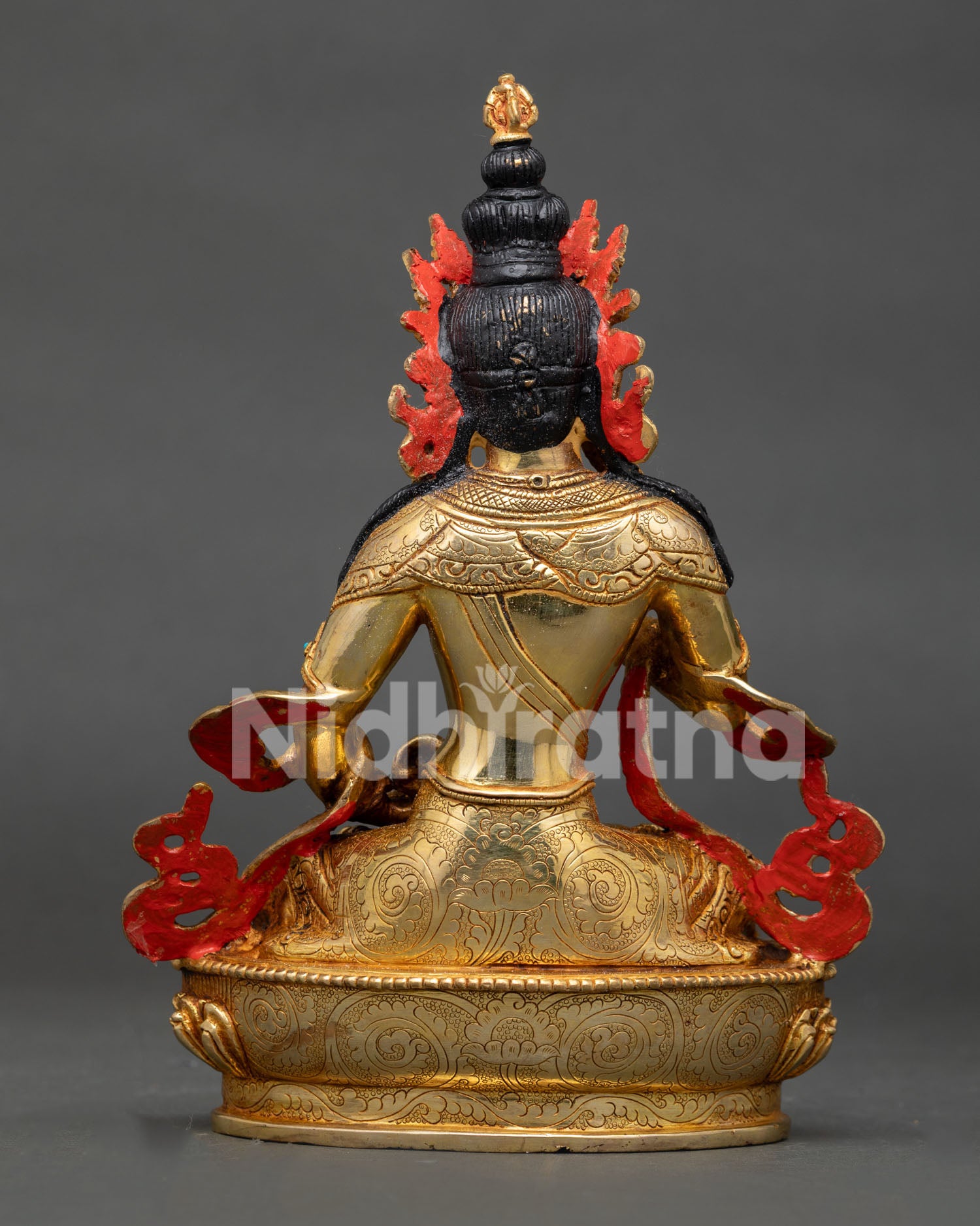 Back view of Vajrasattva statue showcasing gold gilded copper and traditional Nepalese metalwork.