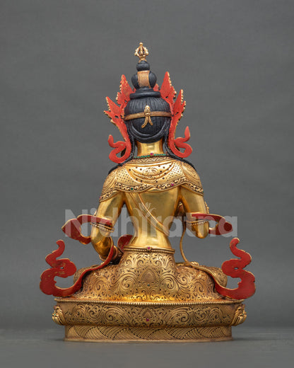 Back view of Vajrasattva statue showing detailed metal repousse.