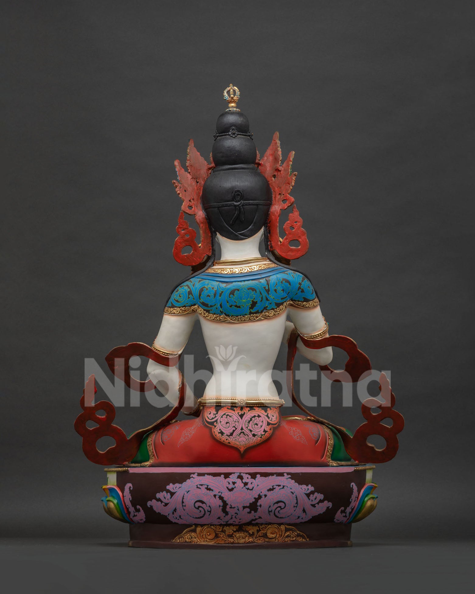 Back view of Vajrasattva statue showing lotus pedestal and copper craftsmanship