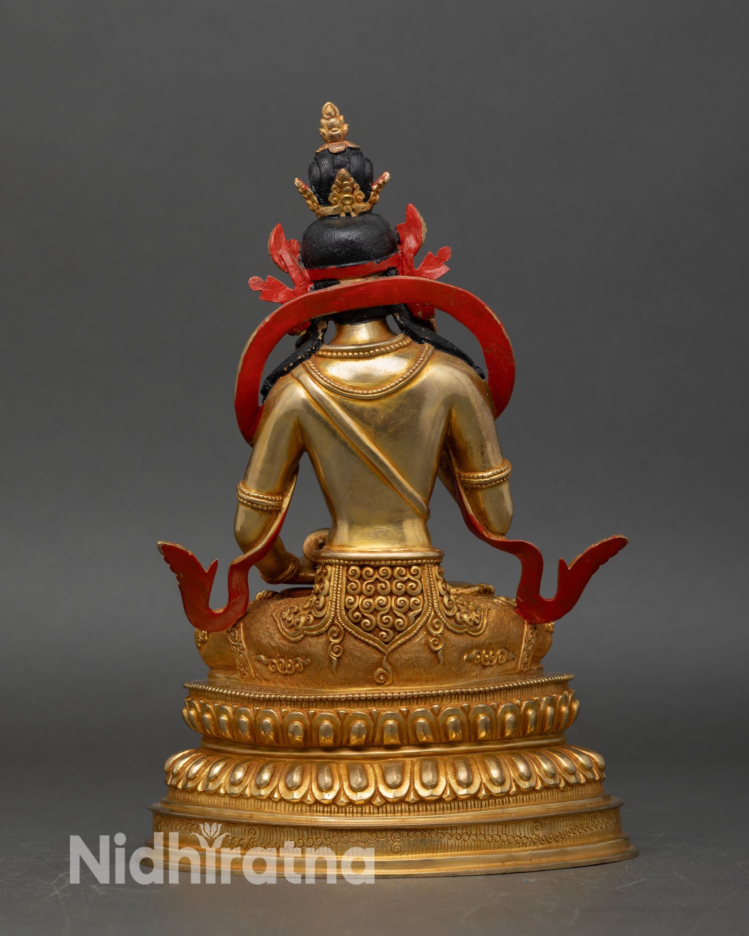 back view of vajrasattva statue with detailed robes and lotus throne engraving