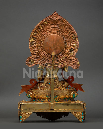 Back view of Vajrasattva with throne showing repoussé carvings and detailed halo
