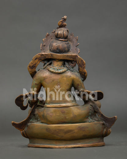 back view of vintage finished dzambhala statue with detailed handcrafted copper workmanship