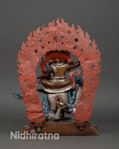 Back view of White Dzambhala statue with skull crown blazing halo and intricate jewelry