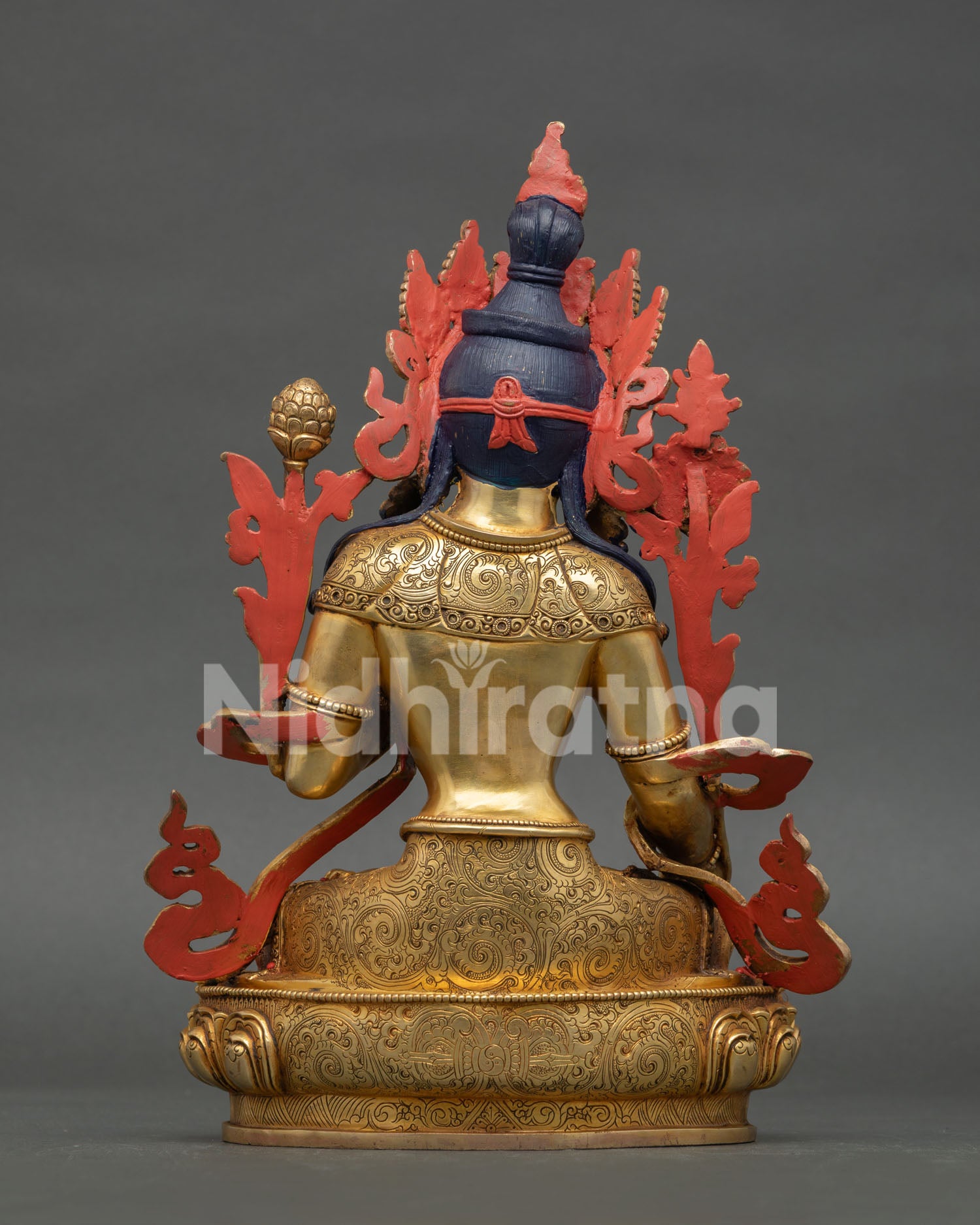 Back view of White Tara Buddhist statue featuring intricate craftsmanship and sacred ornaments