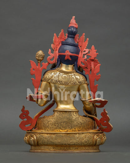 Back view of White Tara Buddhist statue featuring intricate craftsmanship and sacred ornaments