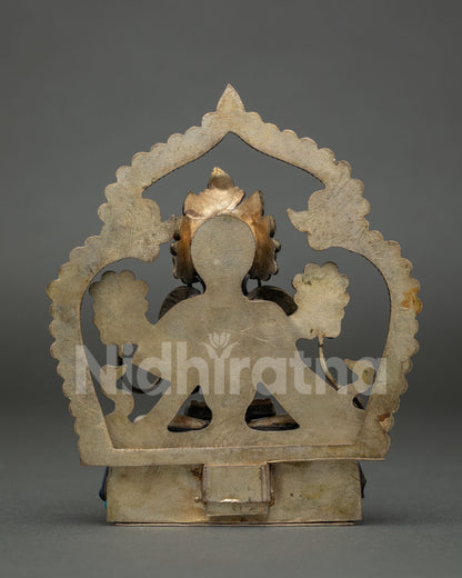 Back view of White Tara copper statue showing handcrafted halo and pedestal from Nepal
