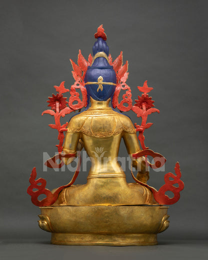 Back view of White Tara statue, gold-fire gilded copper sculpture from Nepal