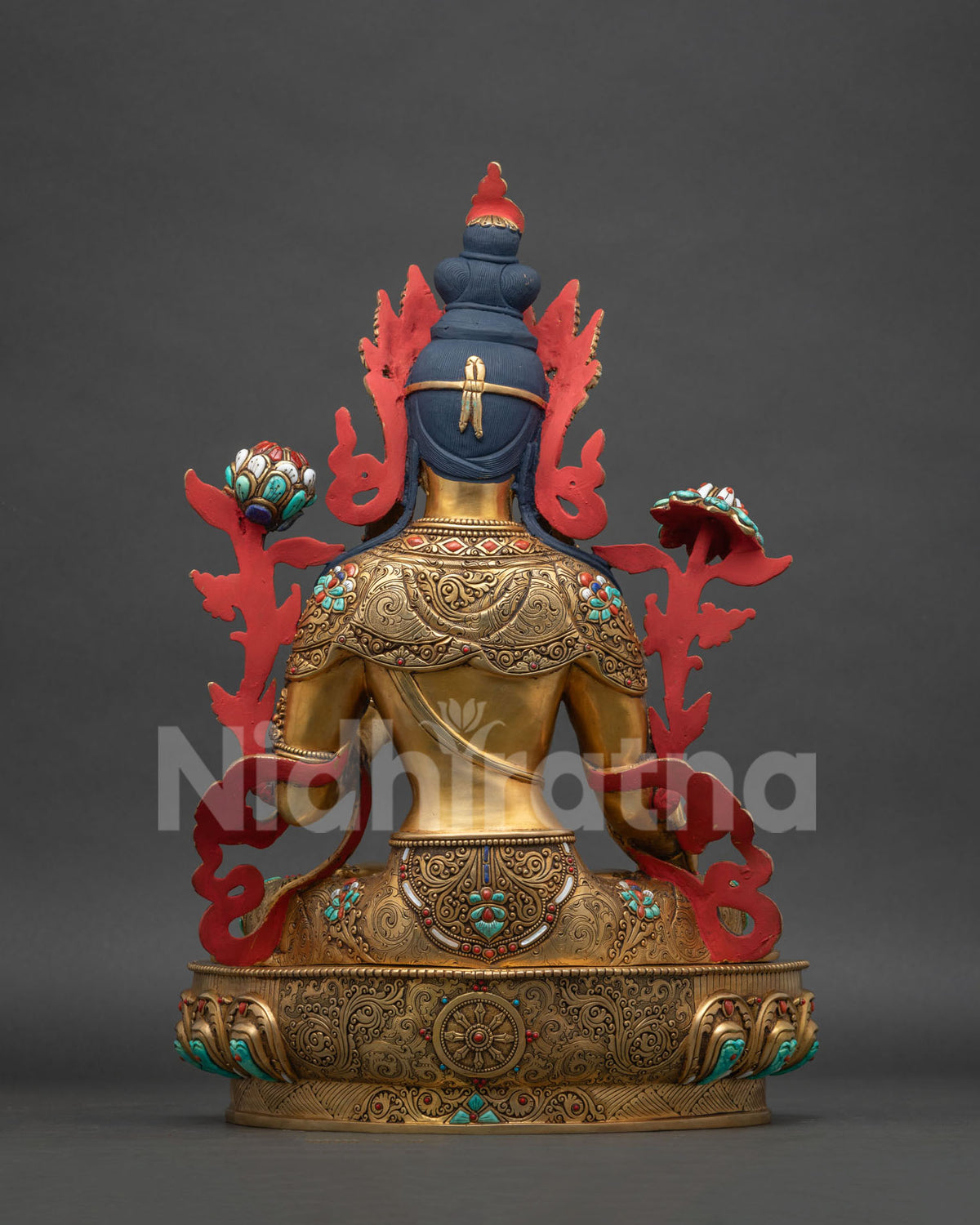 Back view of White Tara statue, gold-gilded copper sculpture from Nepal
