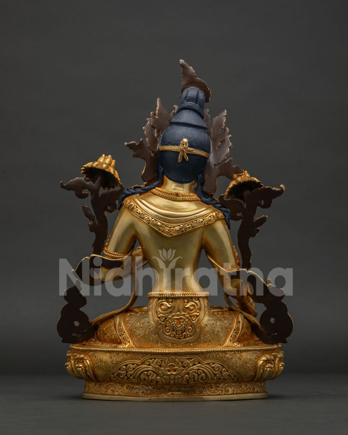 Back view of White Tara Statue, mantra inscribed on hand-carved lotus base