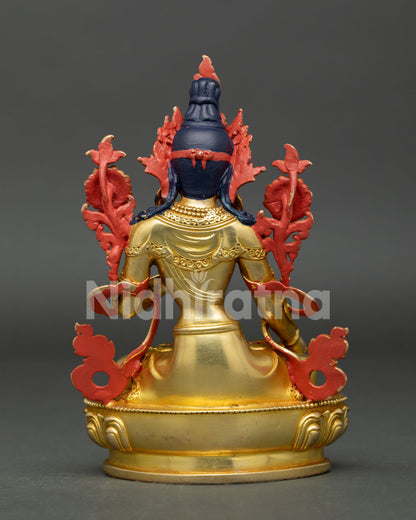 Back view of White Tara statue revealing intricate Buddhist artwork and handcrafted Nepalese metal detailing