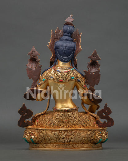 back view of white tara statue showing detailed robe patterns and traditional buddhist artistry