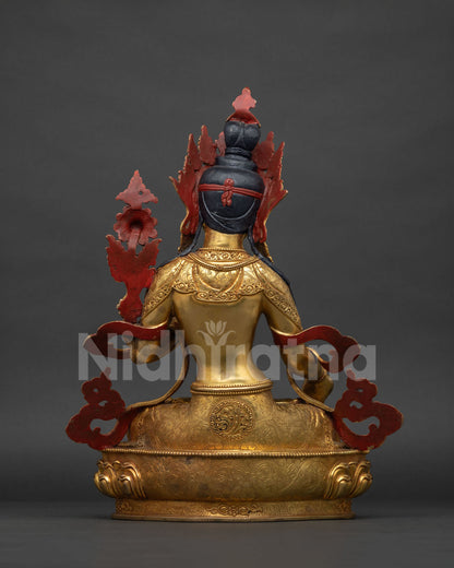 Back view of White Tara statue showing lotus throne and robe detail