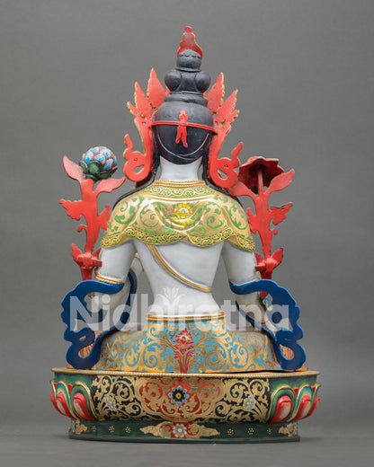 back view of white tara statue with detailed lotus throne and gilded finish