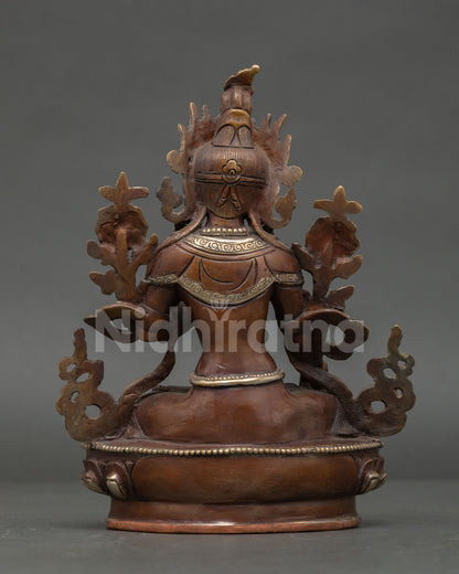 back view of white tara statue with engraved lotus base and traditional nepalese art