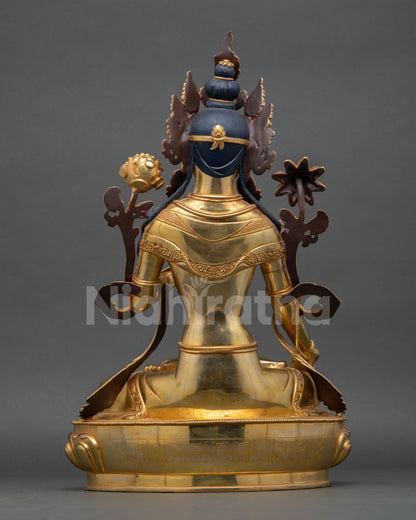 back view of white tara statue with engraved robe details and lotus pedestal