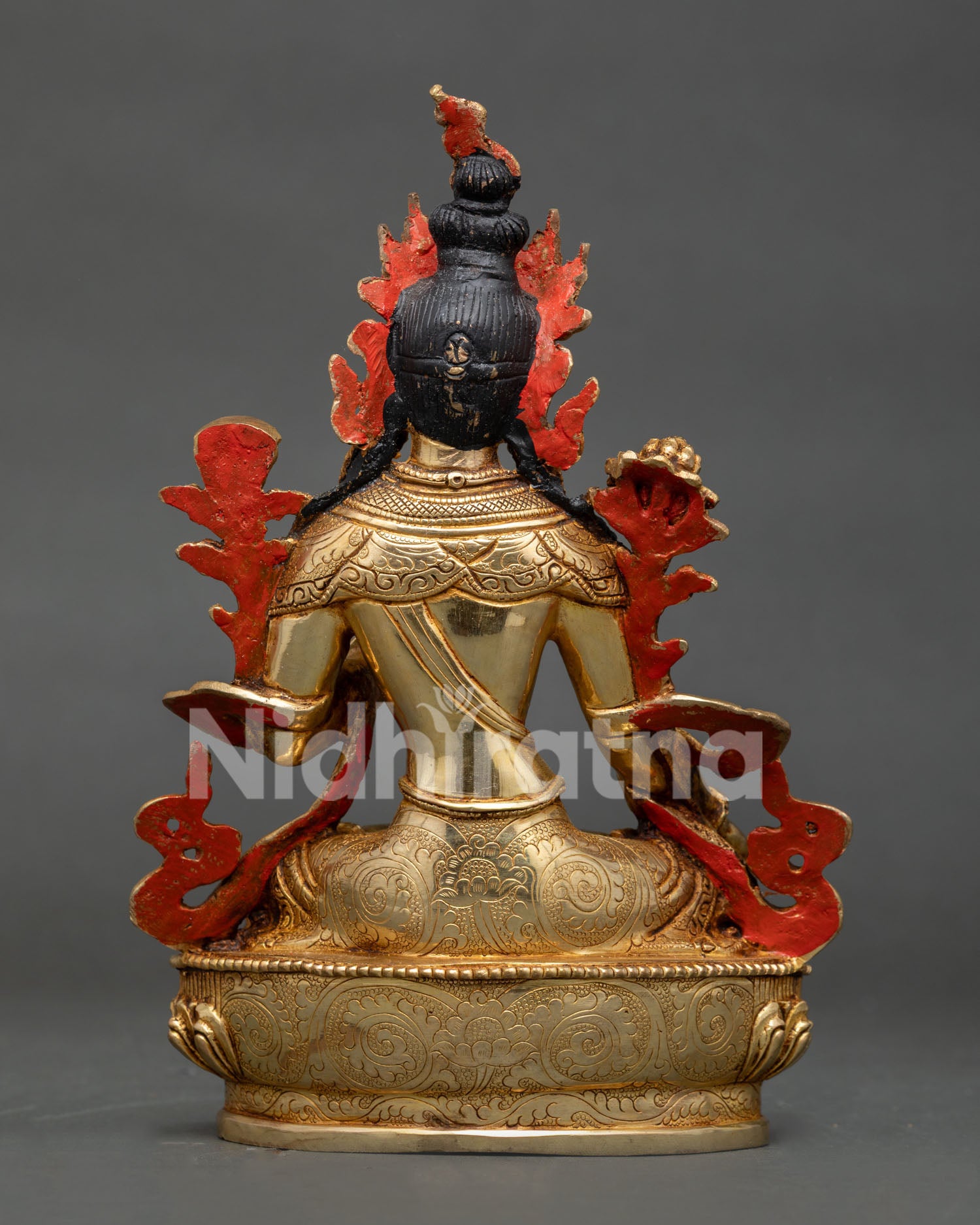 Back view of White Tara statue with gold gilded copper body and detailed lotus pedestal craftsmanship