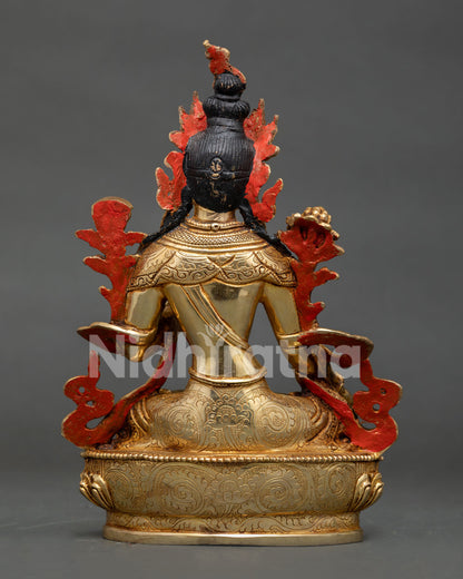 Back view of White Tara statue with gold gilded copper body and detailed lotus pedestal craftsmanship