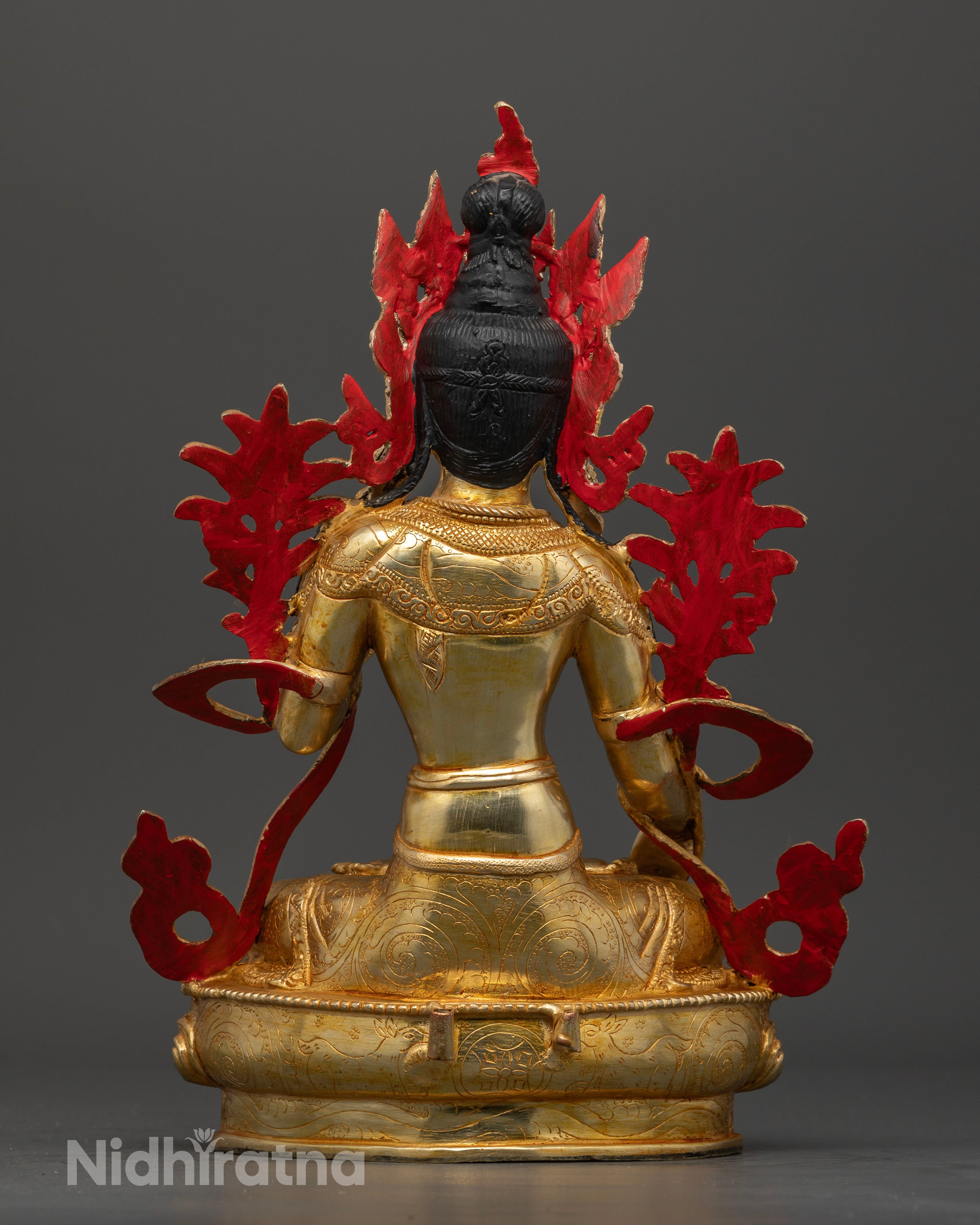 Back view of White Tara statue with traditional fire gilded copper craftsmanship