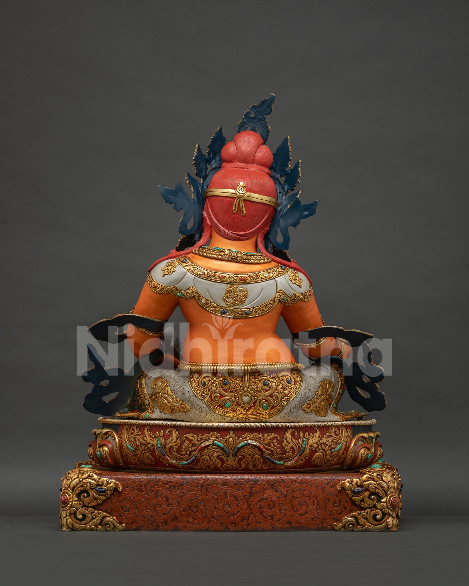 Back view of Yellow Dzambhala statue showing gold gilded crown and Newari craftsmanship detail