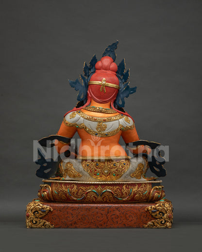 Back view of Yellow Dzambhala statue showing gold gilded crown and Newari craftsmanship detail