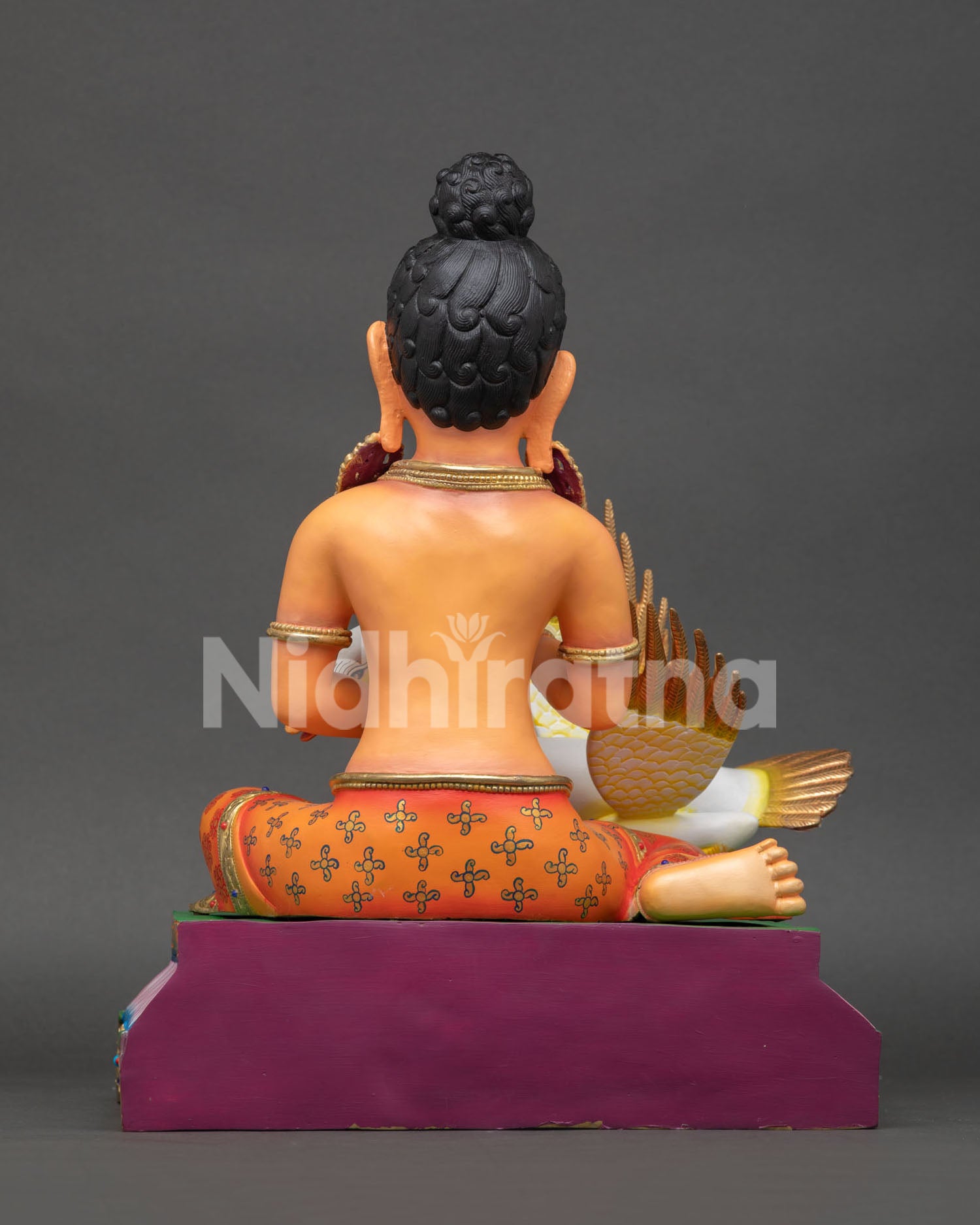 Back view of Young Buddha Saving the Swan handcrafted copper Buddhist statue