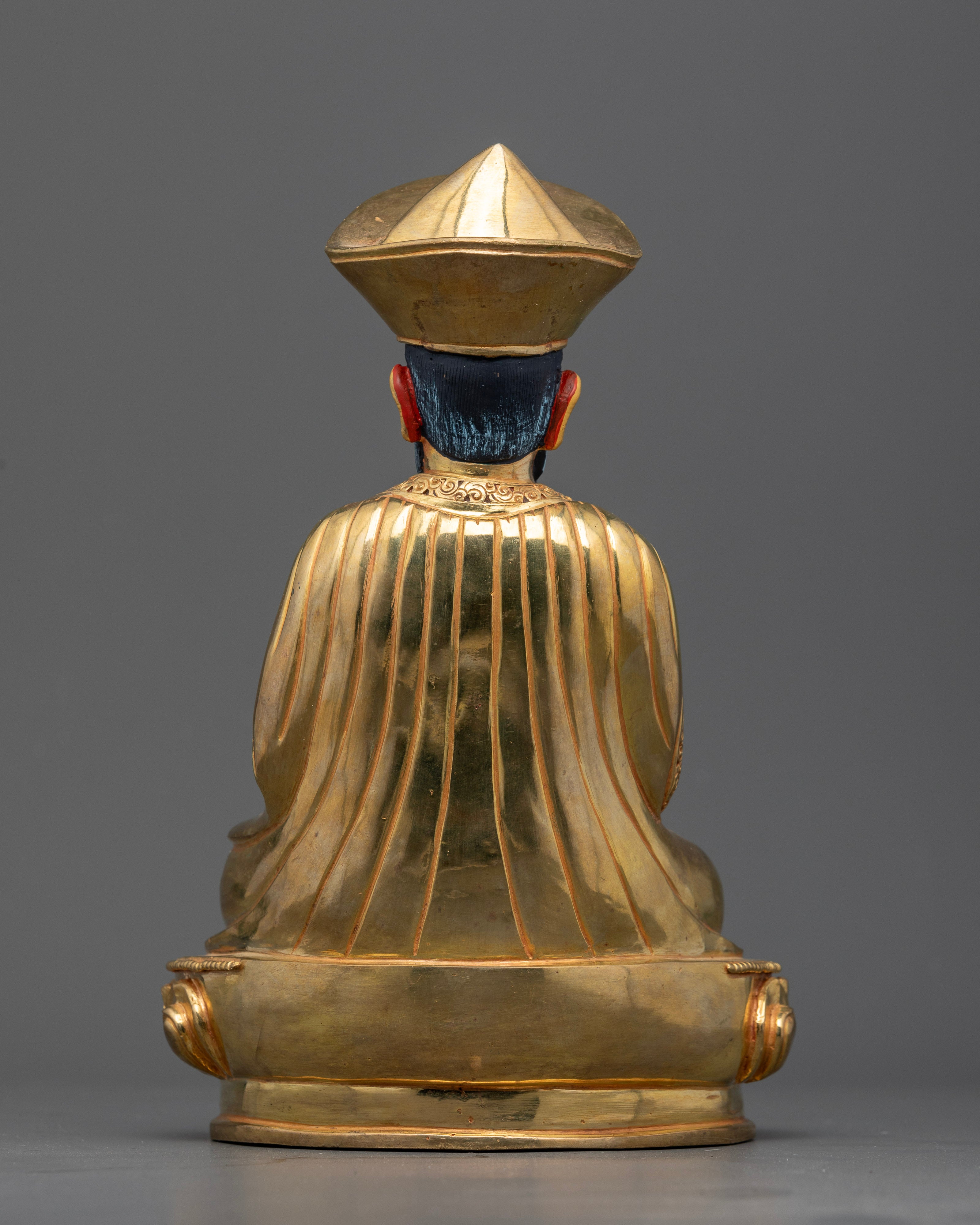 Back view of zhabdrung ngawang namgyal statue, showing detailed engravings and sculptural craftsmanship