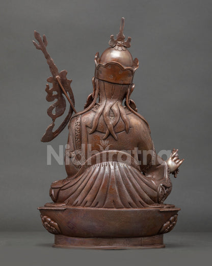 Back view of oxidized copper Guru Rinpoche Buddhist statue for altar meditation shrine and spiritual home decor collection