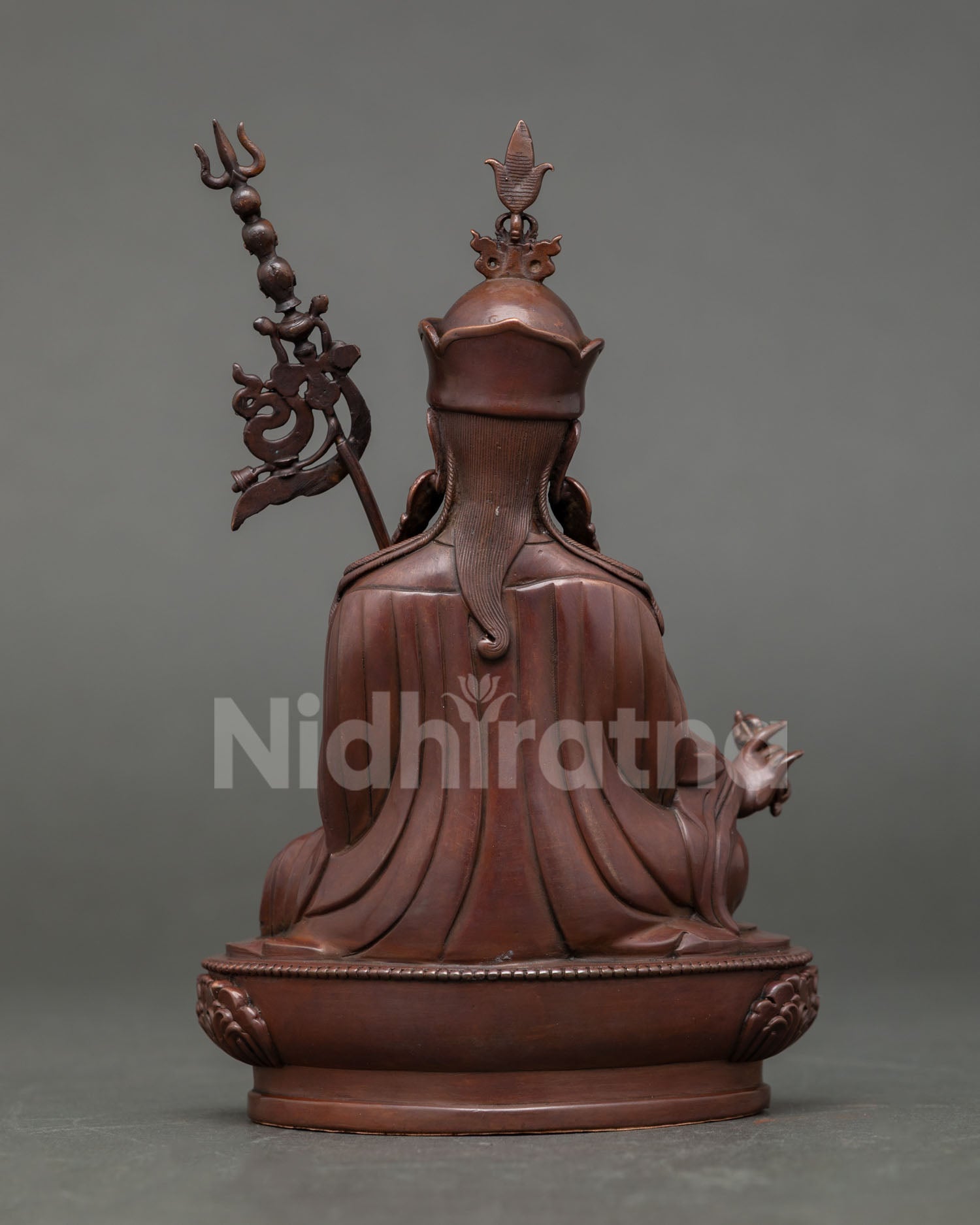 Back view of oxidized copper Guru Rinpoche sculpture handcrafted by Newari artisans for meditation and shrine decor