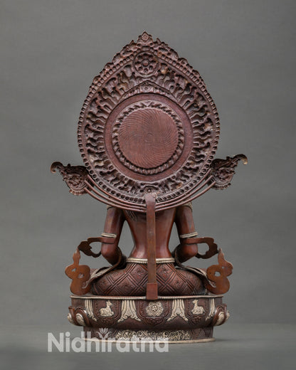 Back view of sacred Amitayus statue with detailed halo and traditional Himalayan craftsmanship
