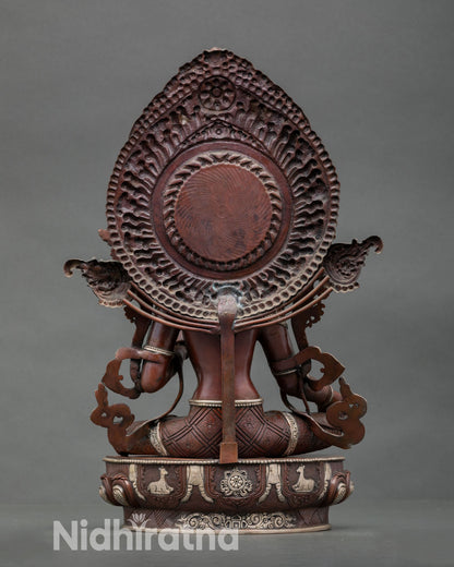 Back view of sacred Green Tara sculpture with detailed robes silver accents and traditional Newari craftsmanship for Buddhist shrine