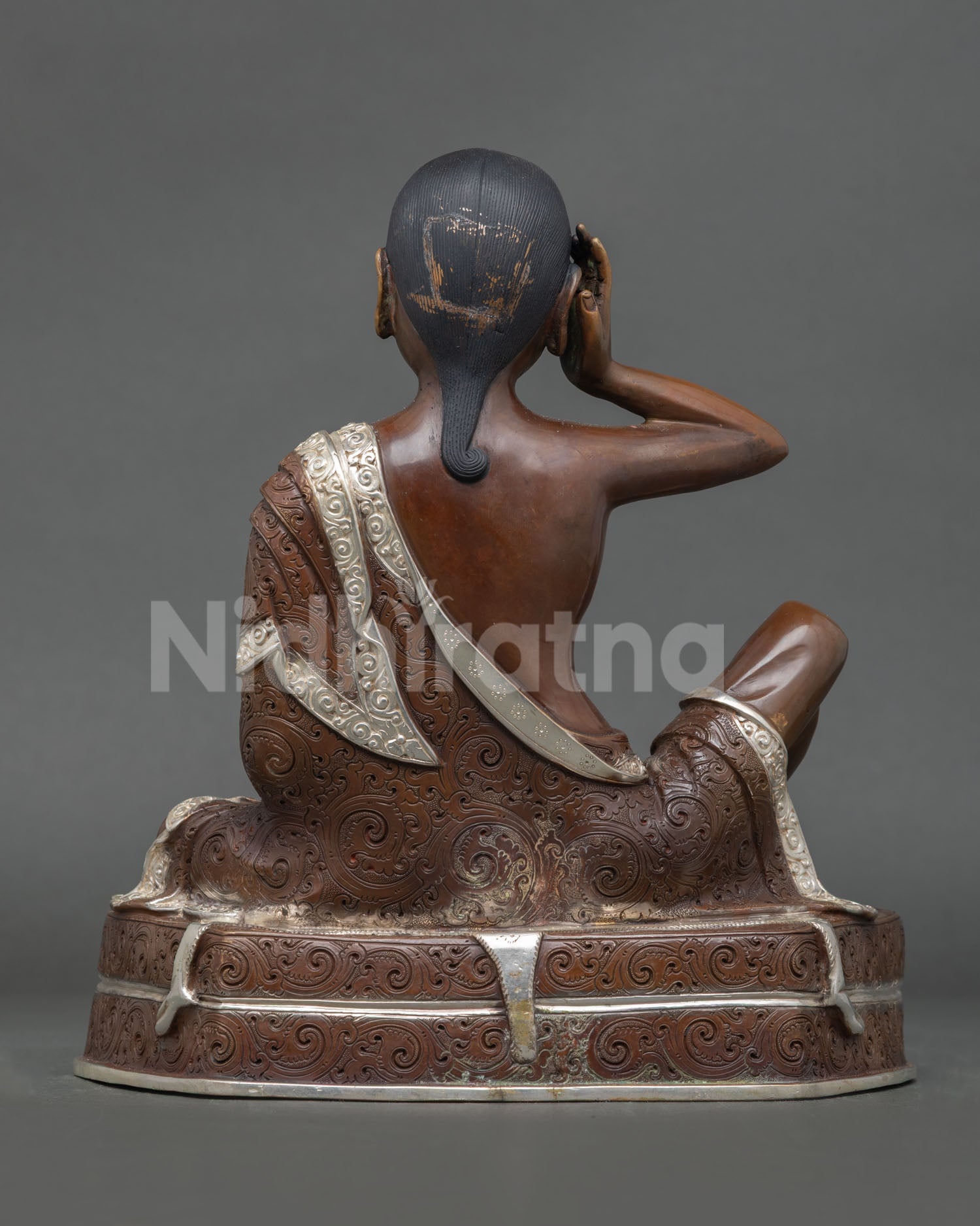Back view of sacred Milarepa statue for Buddhist altar meditation space and spiritual home decor handcrafted in Patan, Nepal