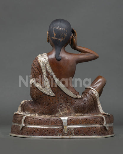 Back view of sacred Milarepa statue for Buddhist altar meditation space and spiritual home decor handcrafted in Patan, Nepal