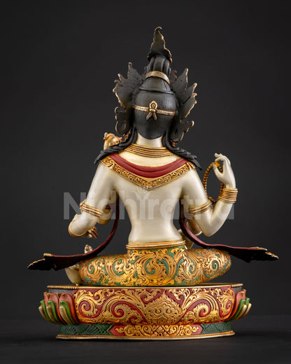 Back view of Saraswati statue Nepal handcrafted white toned goddess sculpture gold detailing Himalayan sacred art piece meditation altar spiritual decor
