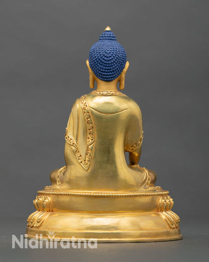 Back view of Shakyamuni Buddha handcrafted statue engraved base border oxidized copper Nepal Buddhist home altar sacred sculpture art