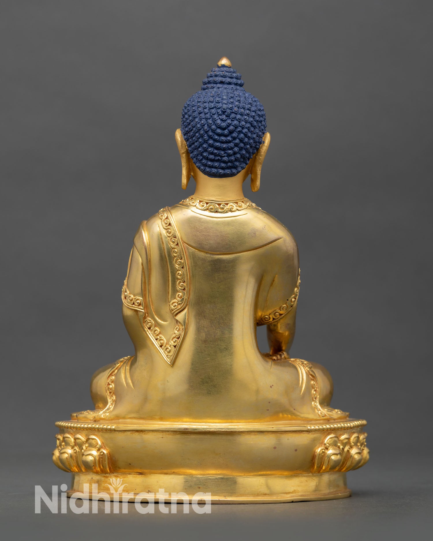 Back view of Shakyamuni Buddha handcrafted statue lost wax casting detailed copper finish Tibetan Buddhist home altar sculpture