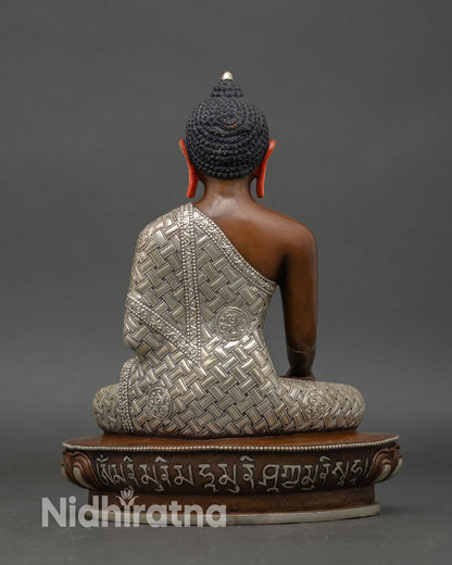 Back view of Shakyamuni Buddha statue detailed monastic robes lotus throne handcrafted