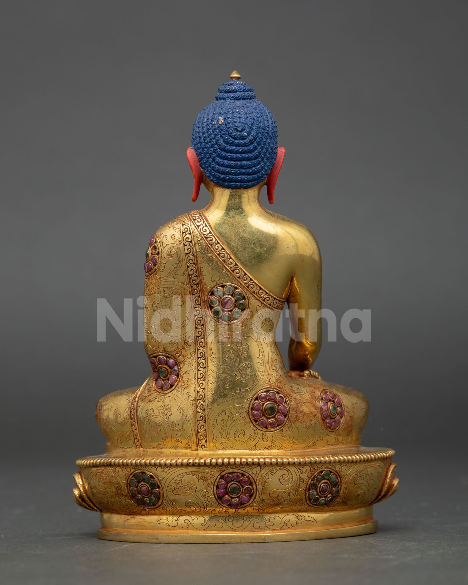 back view shakyamuni buddha statue engraved lotus throne detailing copper nepal buddhist art