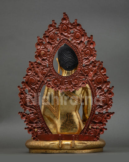 back view shakyamuni buddha statue gold fire gilded robe engraving ornate halo metalwork