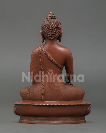 Back view of Shakyamuni Buddha statue, copper oxidized finish, Himalayan Buddhist art  shrine decor, Enlightened Buddha sculpture