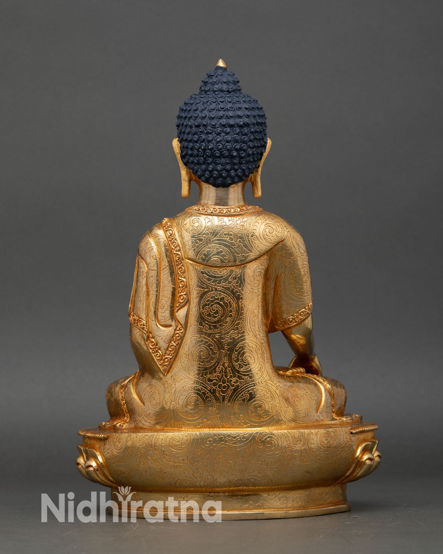Back view of Shakyamuni Buddha statue, lotus pedestal detailed craftsmanship Himalayan art