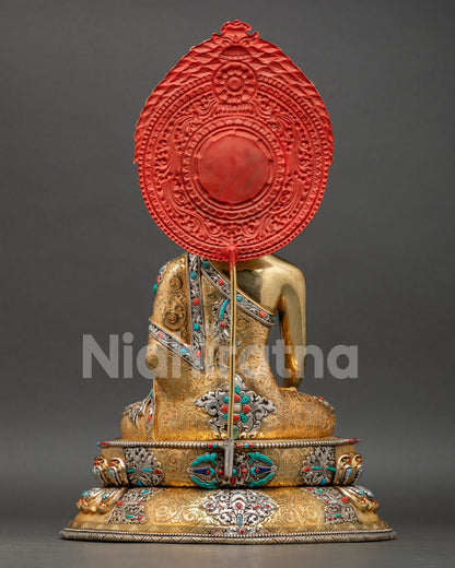 Back view of Shakyamuni Buddha statue ornate halo back detailing copper Buddhist art Nepal handcrafted sculpture meditation sacred space decor