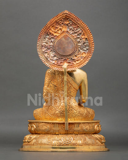 Back view Shakyamuni Buddha statue ornate halo detailing copper Buddhist sculpture Nepal handcrafted spiritual meditation decor